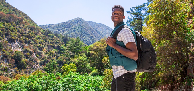 Man backpack hiking in the forest