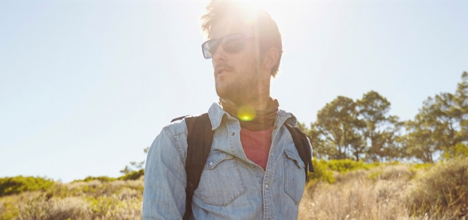 A man hiking in blazing sun