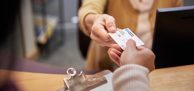 Member presenting BCBNM Member ID card